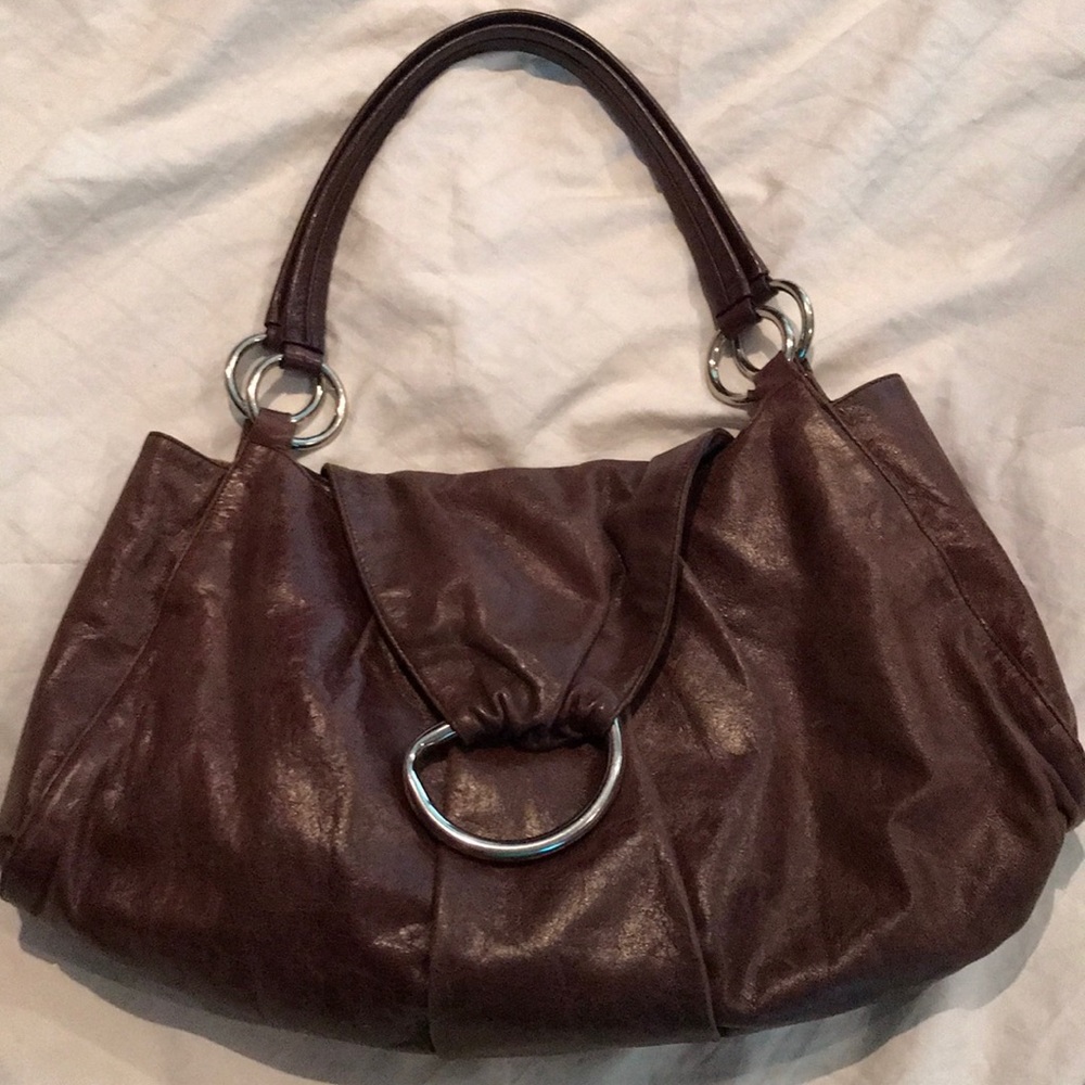 Brown distressed leather hobo bag.